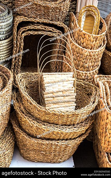 Empty wicker baskets are for sale in a market place