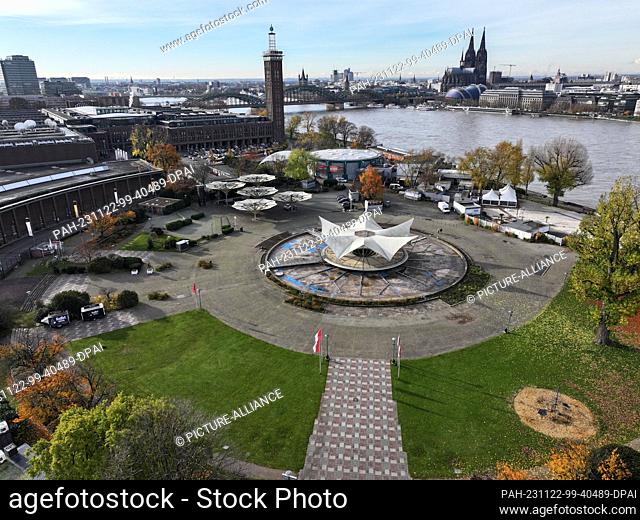22 November 2023, North Rhine-Westphalia, Cologne: Cologne's Tanzbrunnen, with the Rhine and the cathedral in the background (aerial view with drone)