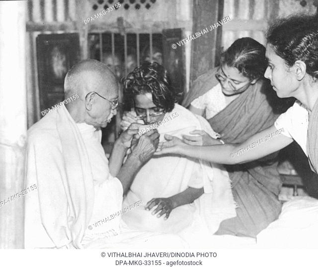 Mahatma Gandhi visits a fasting co-worker, January 1947 - MODEL RELEASE NOT AVAILABLE