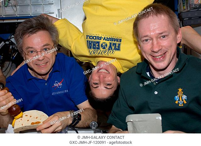 Canadian Space Agency astronaut Robert Thirsk (left), NASA astronaut Nicole Stott and European Space Agency astronaut Frank De Winne
