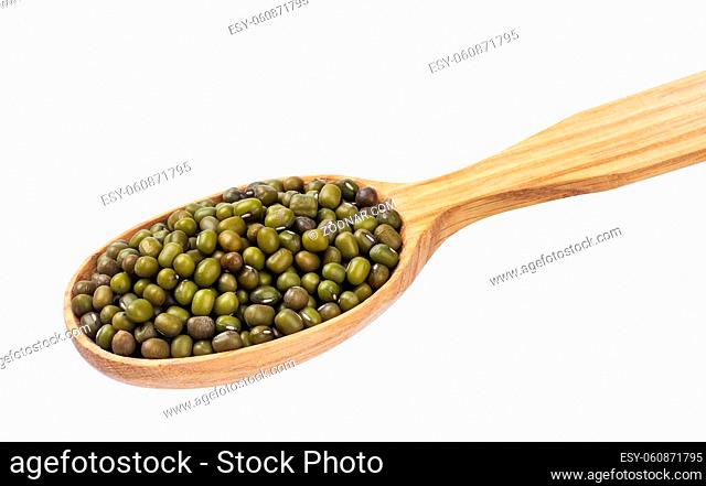 Green mung in wooden spoon isolated on white background. One of the collection