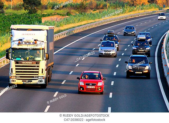 Catalunya, Spain, Girona province, Gironés area, Traffic at the AP-7 Autopista del Mediterráneo near Pont de Molins. The Autopista AP-7 is a Spanish highway and...