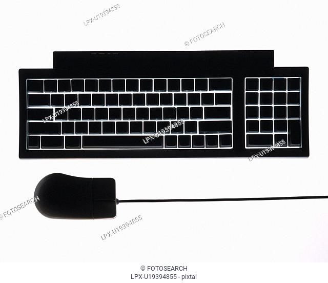 Silhouette of computer keyboard and mouse, high angle view, white background