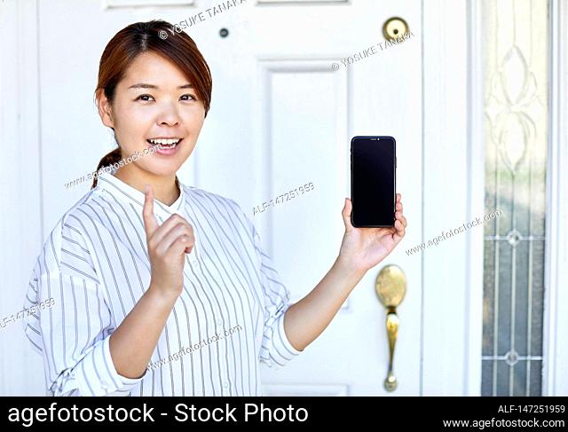 Happy Japanese woman at home