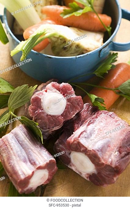 Oxtail and fresh soup vegetables with pan