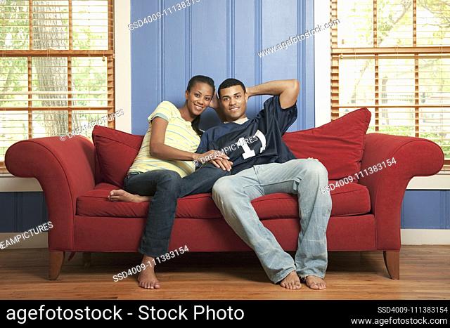 Couple sitting on sofa together