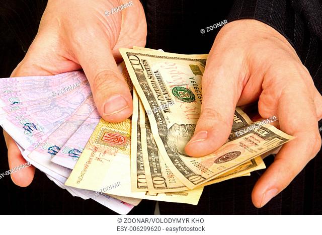 hand of a businessman holding a money
