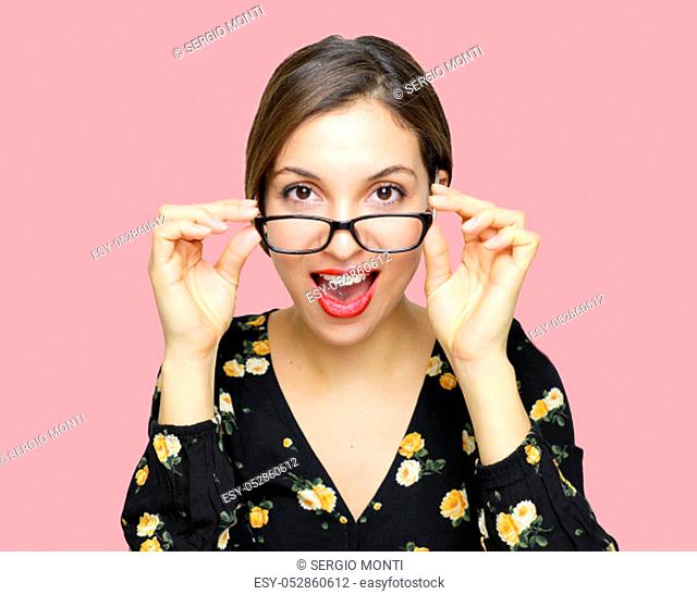 Wow! I don't believe you! Close up portrait of shocked astonished woman with open mouth and retro vintage style touching her spectacles