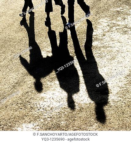 Pedestrians and their shadows, Castro Urdiales, Cantabria, Spain