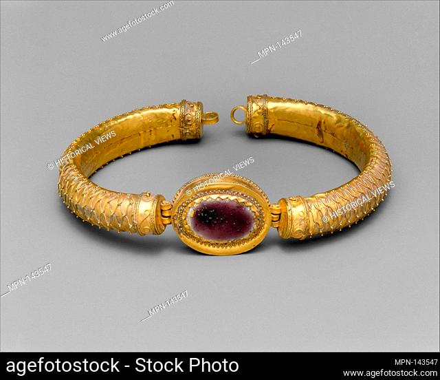 Gold and glass bracelet with central medallion. Period: Hellenistic; Date: 2nd century B.C; Culture: Greek; Medium: Gold and glass; Dimensions: diameter 3 7/16...