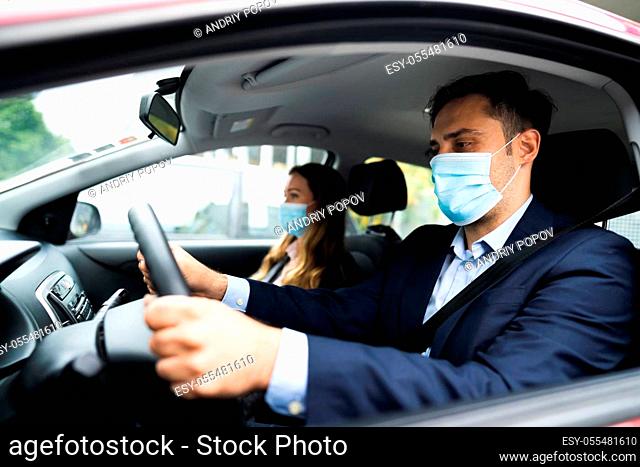 People Carpooling And Car Sharing With Face Masks