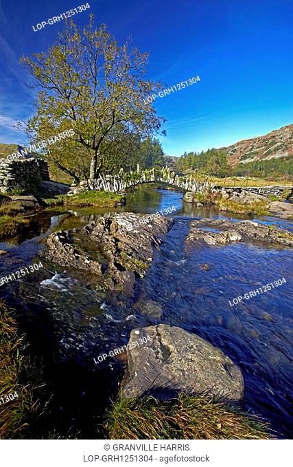England, Cumbria, Skelwith Bridge. A view of Slater Bridge which crosses the River Brathay on its way from Little Langdale Tarn to Elterwater