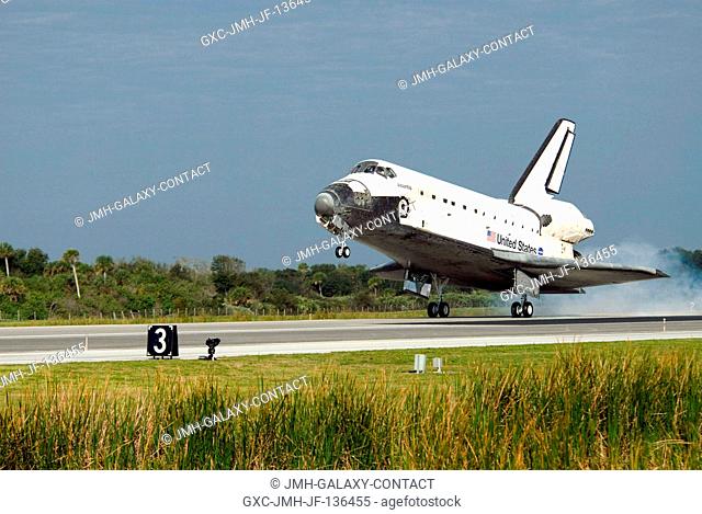Space Shuttle Atlantis touches down on runway 15 of the Shuttle Landing Facility at NASA's Kennedy Space Center, concluding the 13-day STS-122 mission