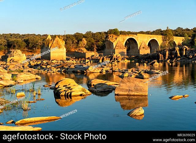 Destroyed abandoned Ajuda bridge crossing the Guadiana river between Spain and Portugal