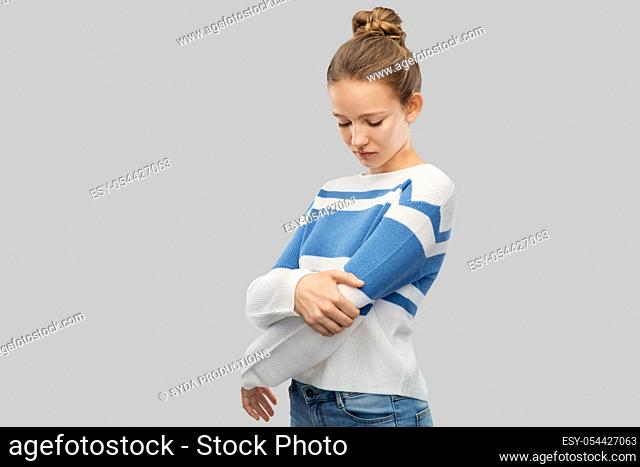 teenage girl having pain in hand