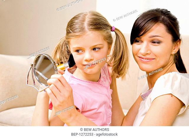 Woman and her daughter improving their appearance