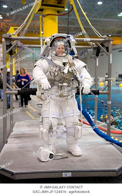 Attired in a training version of her Extravehicular Mobility Unit (EMU) spacesuit, astronaut Tracy Caldwell, Expedition 2324 flight engineer