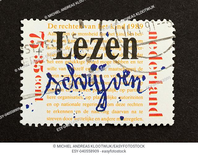 HOLLAND - CIRCA 1980: Stamp printed in the Netherlands shows a writing by a child, circa 1980