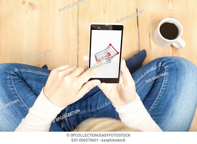 woman typing on shopping cart on smartphone