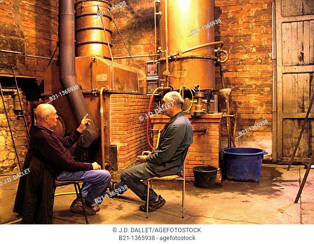 Delord brothers during the distillation of the armagnac, at the Armagnac Delord estate, at Lannepax, Gers, Midi-Pyrenees, France