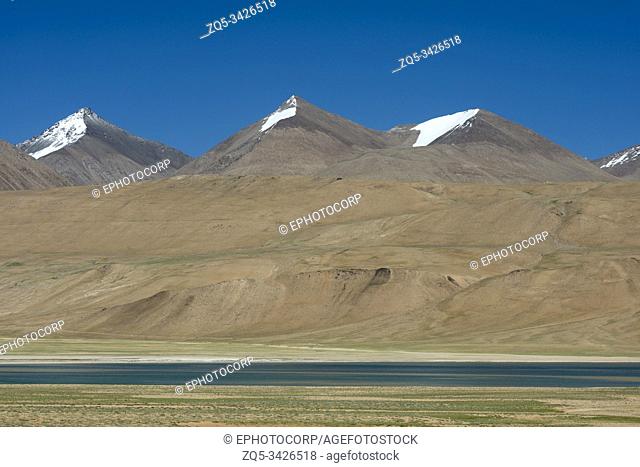 Kyagar Tso lake and snow mountain peaks near Tso Moriri, Ladakh, India