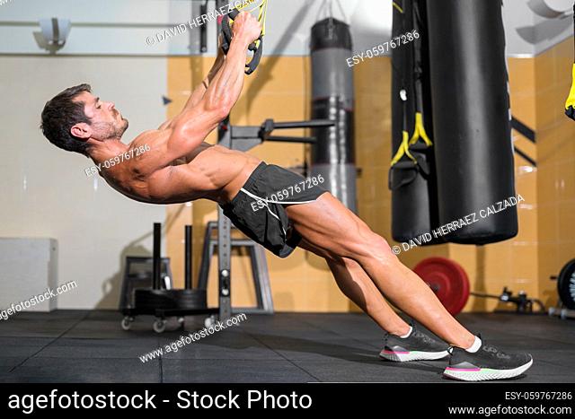 Fitness Man Doing Functional Training At Gym. High quality photo