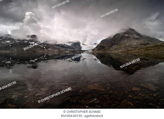 Landscape is reflected in the lake, national park Jotunheimen, Norway