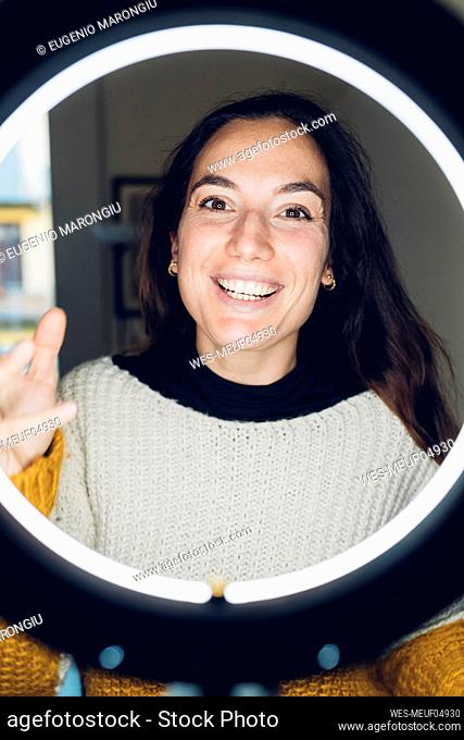 Influencer smiling in front of ring light