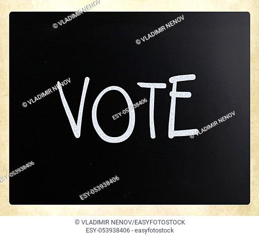 The word 'Vote' handwritten with white chalk on a blackboard