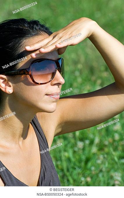 young woman with sun shades in summer