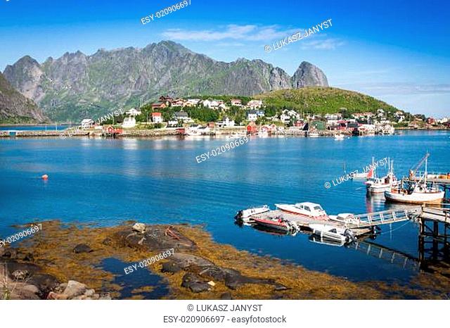 Typical Norwegian fishing village with traditional red rorbu huts, Reine, Lofoten Islands, Norway