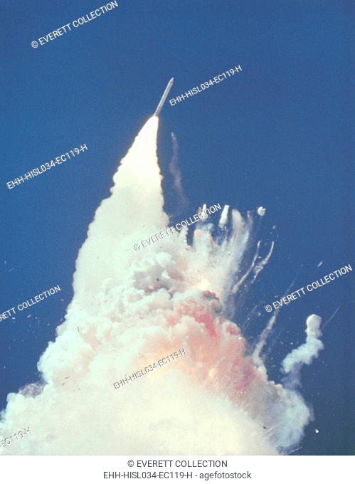 Space shuttle Challenger disaster. 76 seconds into flight, reddish-brown cloud envelops the disintegrating shuttle. Fragments of the shuttle can be seen...