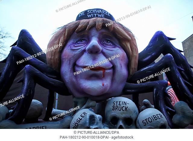 A political caricature float featuring ""German Chancellor Angela Merkel, CDU, as a black widow spider"" is prepared for the Rosenmontag (Shrove...