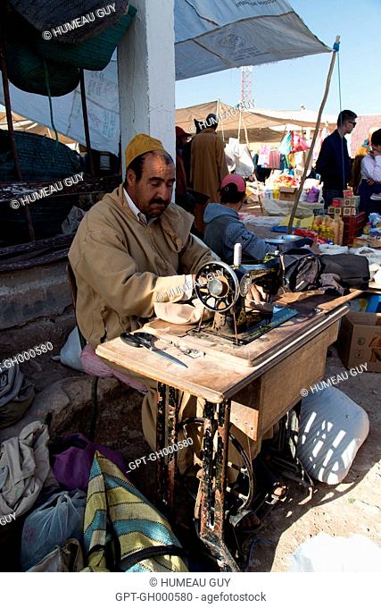 THE BERBER MARKET OF IDA OUDGOURD, ECOTOURISM AND HIKING, IN THE MARKET A TAILOR OFFERS HIS SERVICES, A SOLELY MEN'S MARKET, ESSAOUIRA, MOGADOR, ATLANTIC OCEAN