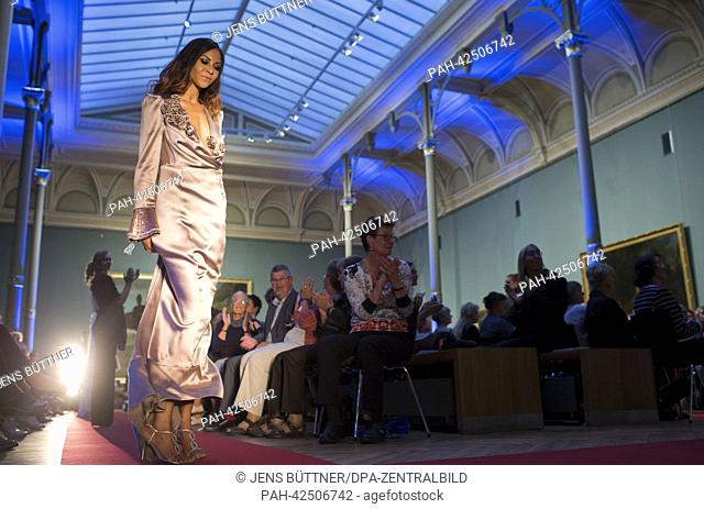 Models present the newest creations by fashion designer Andrej Subarew in front of the painting 'Rhinozeros Clara' by Jean Baptiste Oudry in the Oudry Hall at...