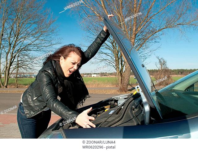 young woman has a car breakdown