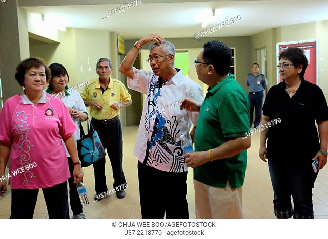 North City council's mayor discussing exercise at Sungai Maong Community Hall, Kuching, Sarawak, Malaysia