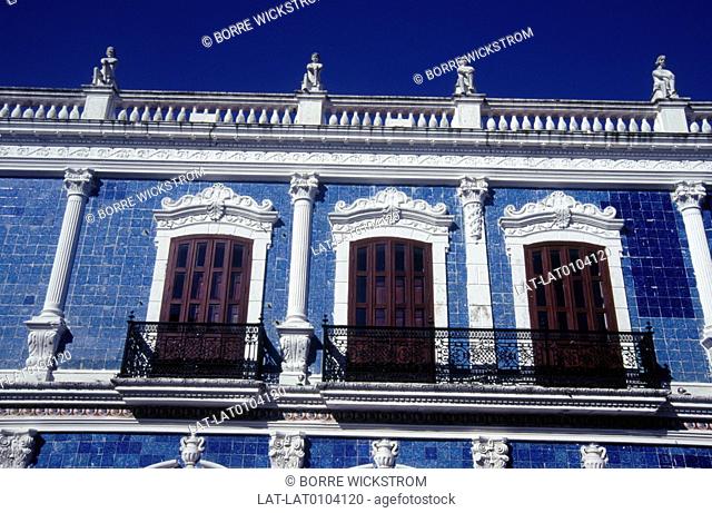 Town. Facade of house. Blue, white paint