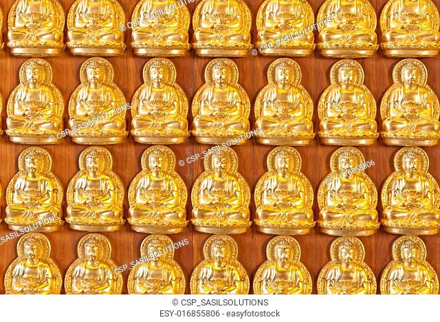 Hundreds of golden Budhha statues background