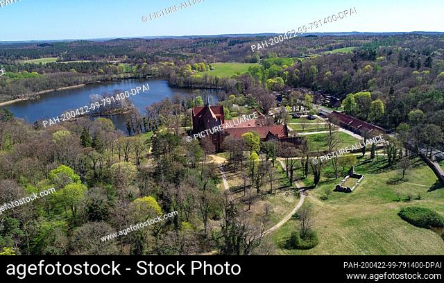 22 April 2020, Brandenburg, Chorin: View of the monastery Chorin with the Amtssee behind it (aerial view with a drone). The complex of the monastery of Chorin...