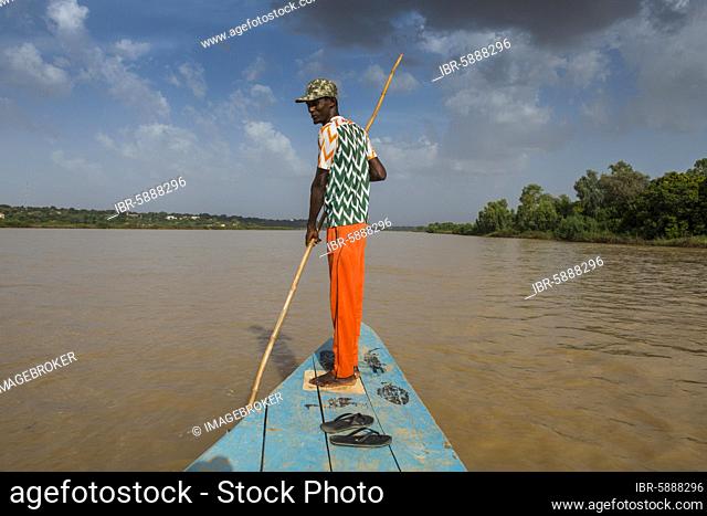 Man in front of a boat, Niger river, Niamey, Niger, Africa