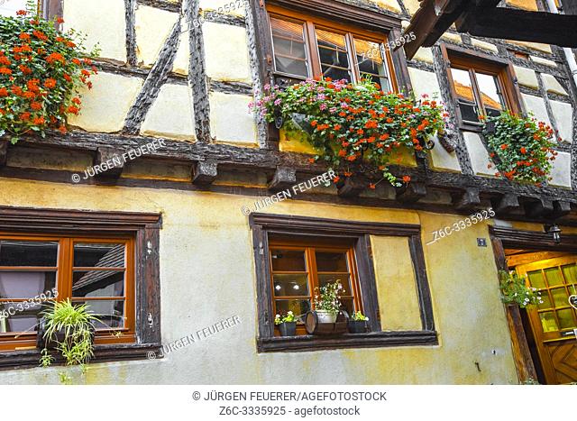 Eguisheim, Alsace, timber house with typic flower decoration, France