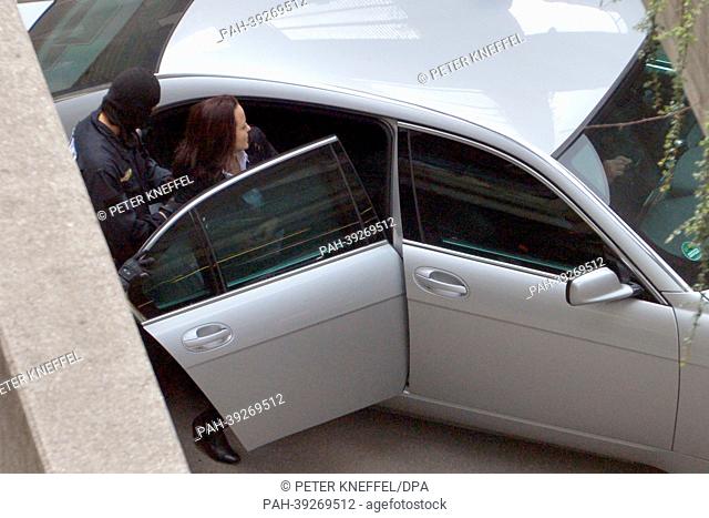 The accused Beate Zschaepe is led to a car after the first day of the NSU trial at the higher regional court in Munich, Germany, 06 May 2013