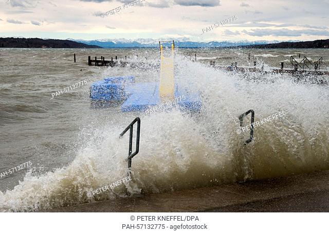A blue bathing island floats in the Starnberg lake and is washed around with waves in Starnberg, Germany, 31 March 2015. The deep depression 'Niklas' brought...