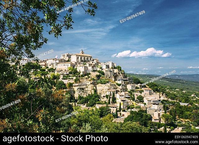 Beautiful scenic view of medieval hilltop village of Gordes in Provence, France. Blue sunny summer sky