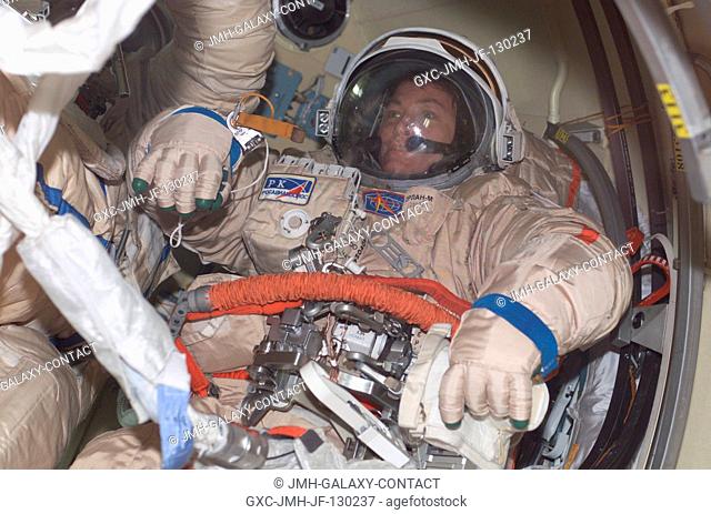 Astronaut Peggy A. Whitson, Expedition Five flight engineer, wears a Russian Orlan spacesuit as she prepares for an upcoming session of extravehicular activity...
