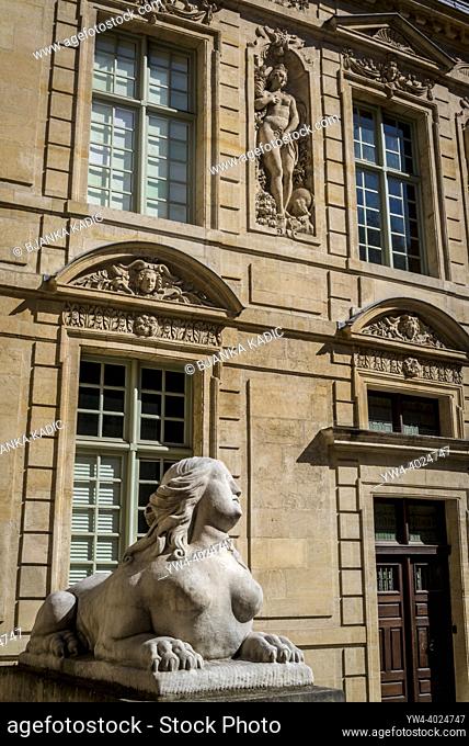 Architectural detail with a sphinx sculpture, Hôtel de Sully, a Louis XIII style hôtel particulier, or private mansion, located at 62 rue Saint-Antoine iParis