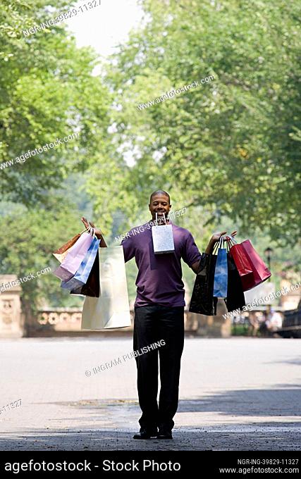 Man holding lots of bags