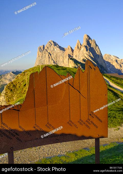 Metal plate with summit explanations, behind it the peaks, Fermeda towers, Geisler peaks, Seceda, Puez-Odle nature park Park, Dolomites, South Tyrol, Italy