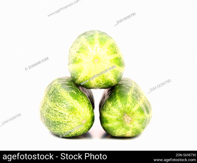 Three tails of cucumber isolated on a white background